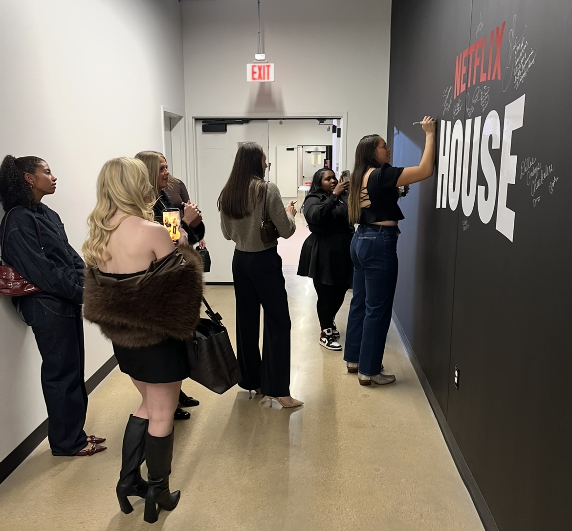 Dallas Trinity FC's Cam Lancaster Writing  Her Netflix Wall Signature - 2